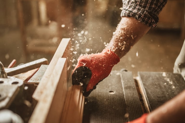 A man using a table saw for woodworking